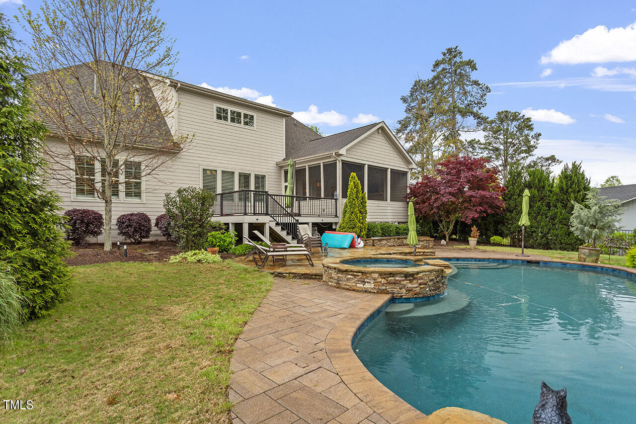 3601 Laurel Hills Road Raleigh, NC 27612 - Photo 75 of 77 a front view of house with yard and outdoor seating