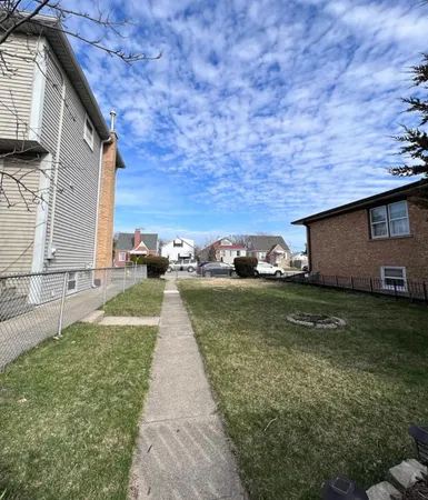 a view of a house with a back yard