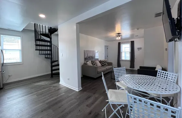 a view of a livingroom with furniture and a window