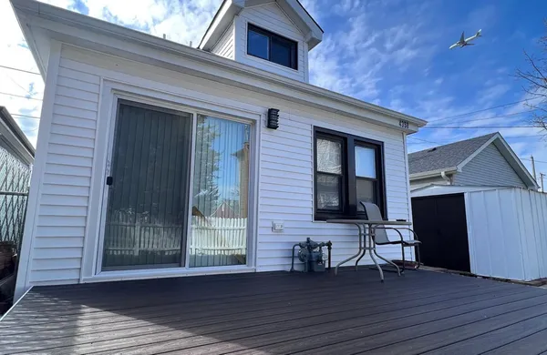 a view of front door and wooden floor