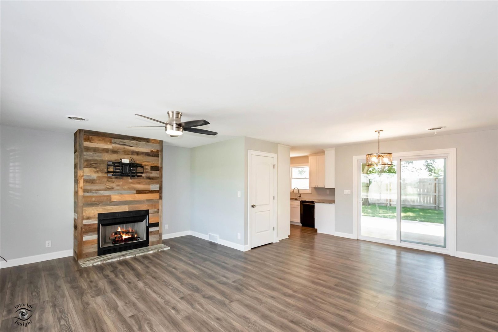 27924 South Scheer Road Peotone, IL 60468 - Photo 4 of 27 an empty room with wooden floor fireplace and windows