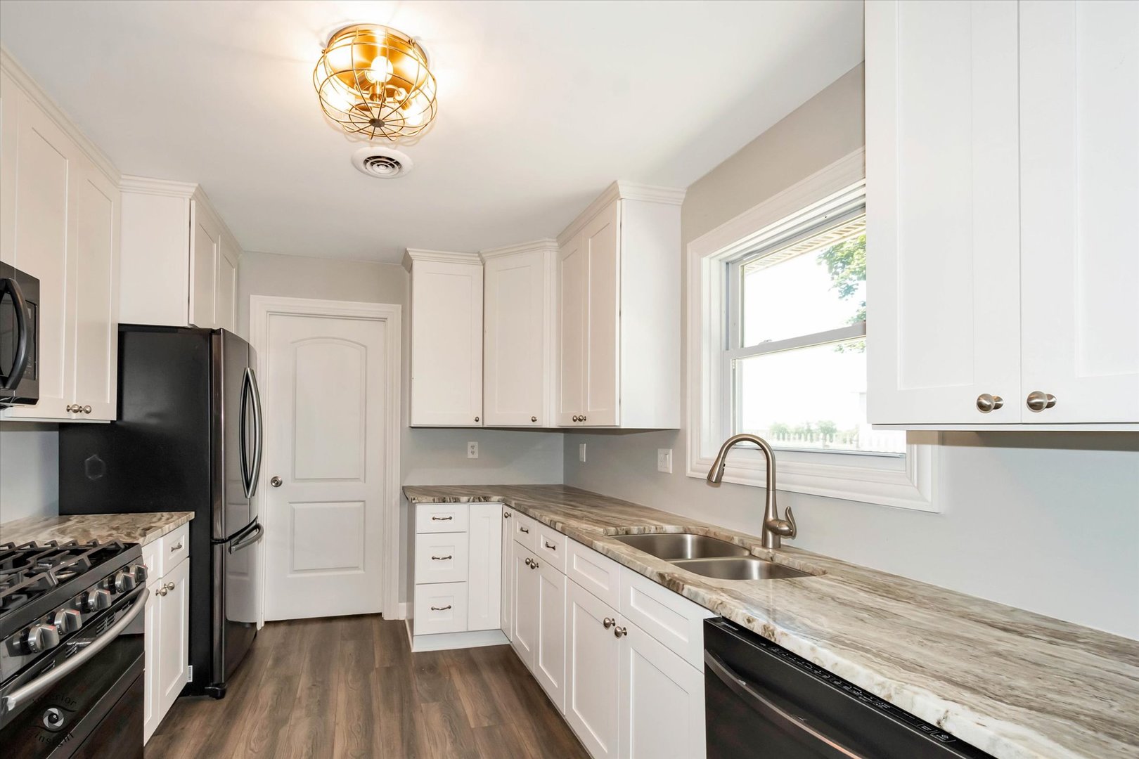 27924 South Scheer Road Peotone, IL 60468 - Photo 10 of 27 a kitchen with a refrigerator and a stove top oven
