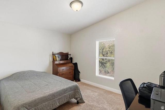 327 North Lodge Road Central, UT 84722 - Photo 20 of 45 Bright room with textured neutral walls, a single window featuring horizontal blinds, and a flush-mount ceiling light fixture