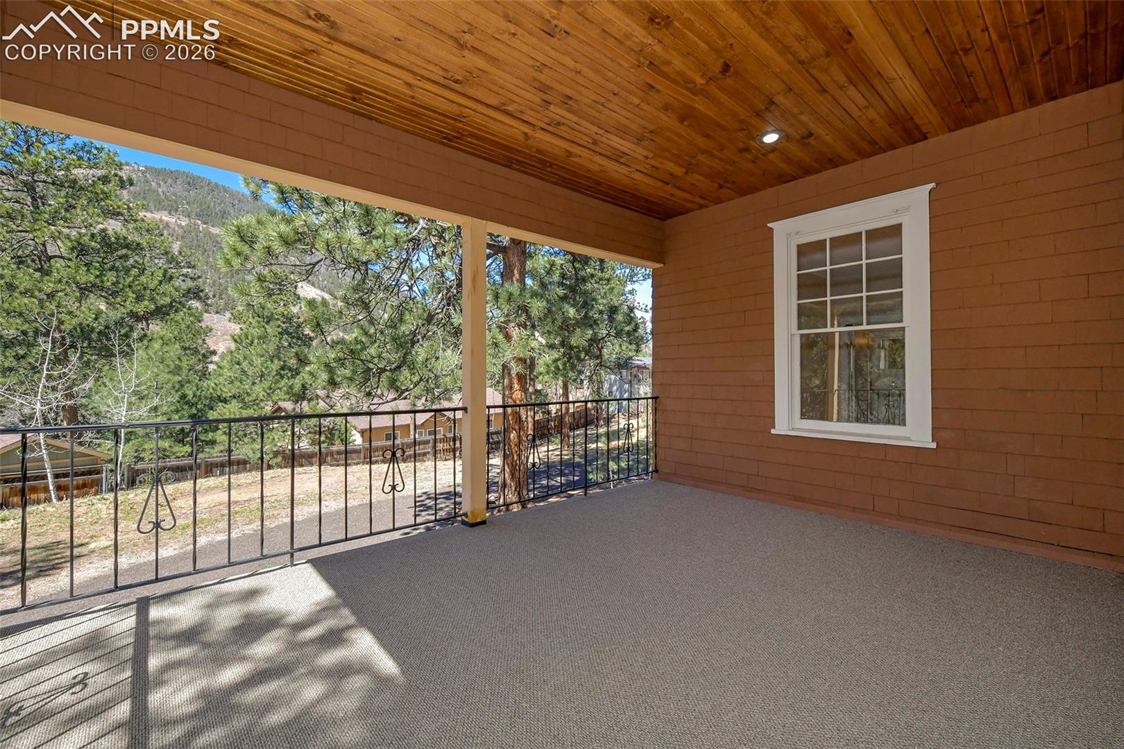 4530 Hagerman Road Cascade, CO 80809 - Photo 8 of 47 Covered Deck/Porch With View Of Back Yard And The Mountains