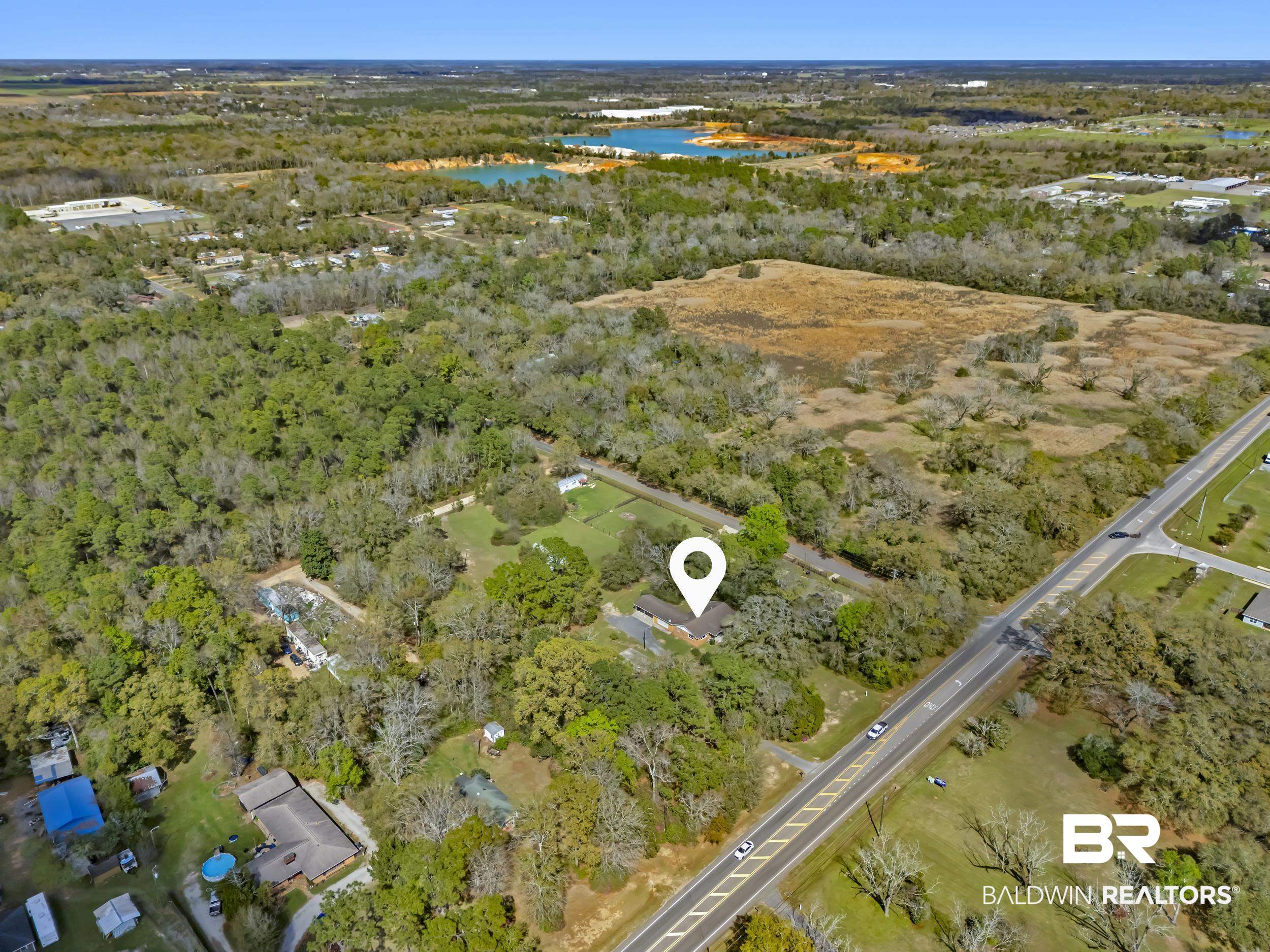 17463 Highway 98 Foley, AL 36535 - Photo 51 of 57 Bird's eye view of a nearby body of water and a forest