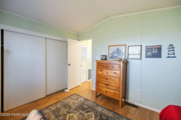 a view of walk in closet with clothes