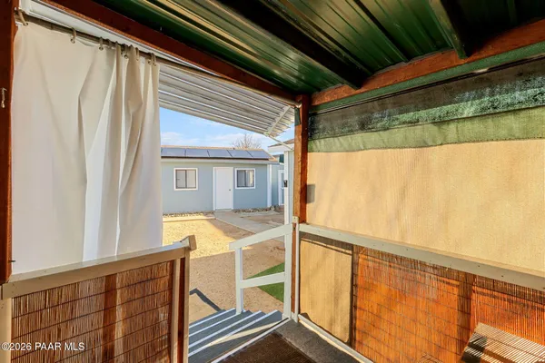 a view of balcony with furniture