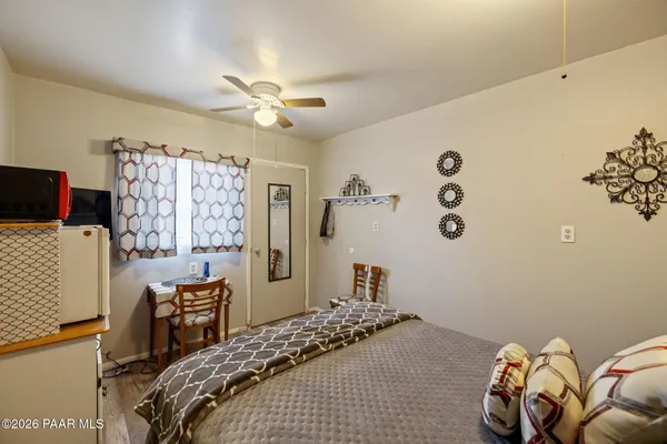 a view of living room with furniture and ceiling fan