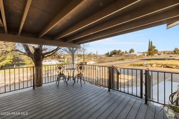 a view of a balcony with wooden floor