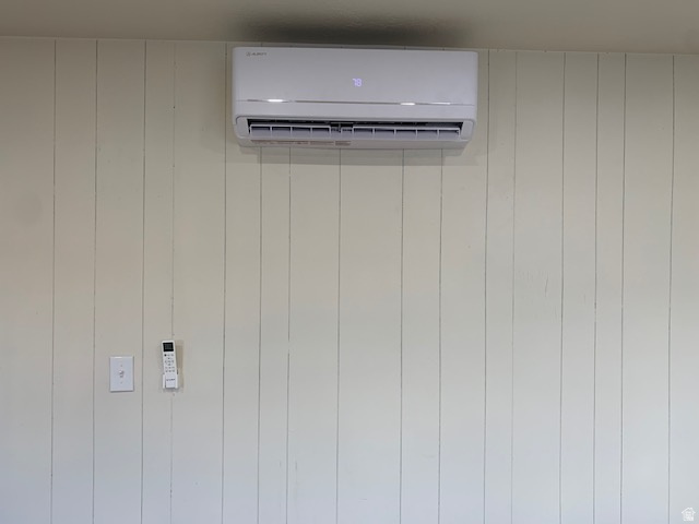 1500 North Angel Street West, Unit 56 Layton, UT 84041 - Photo 6 of 20 Wall-mounted mini-split system on a vertical plank wall, featuring a digital display