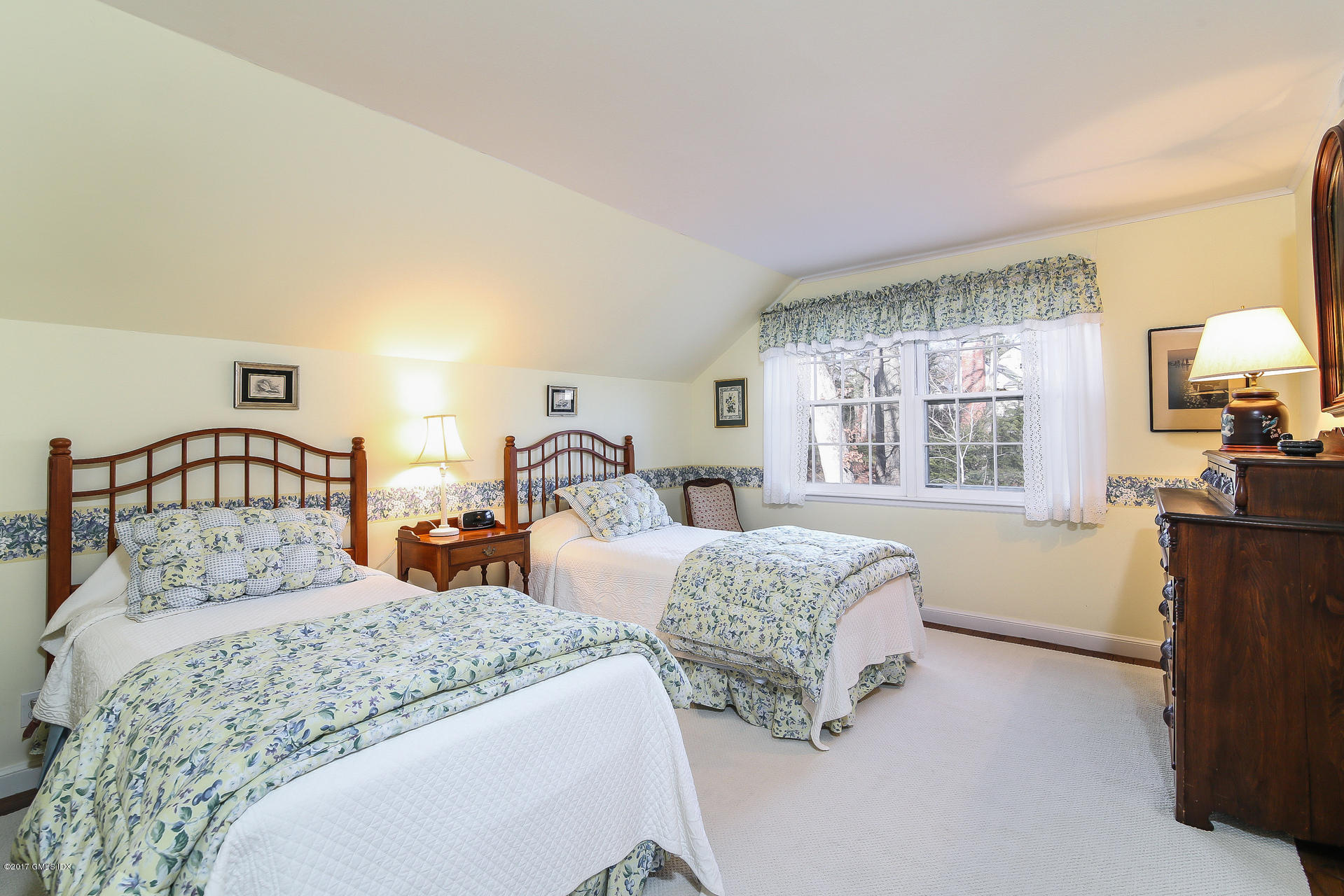 15 Beechcroft Road Greenwich, CT 06830 - Photo 15 of 21 a bedroom with two beds and a window