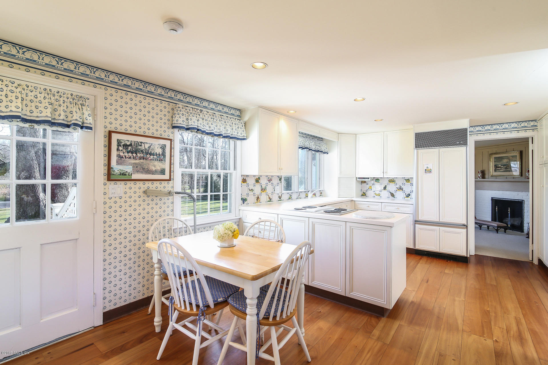 15 Beechcroft Road Greenwich, CT 06830 - Photo 8 of 21 a kitchen with stainless steel appliances granite countertop a kitchen island hardwood floor sink stove dining table and chairs
