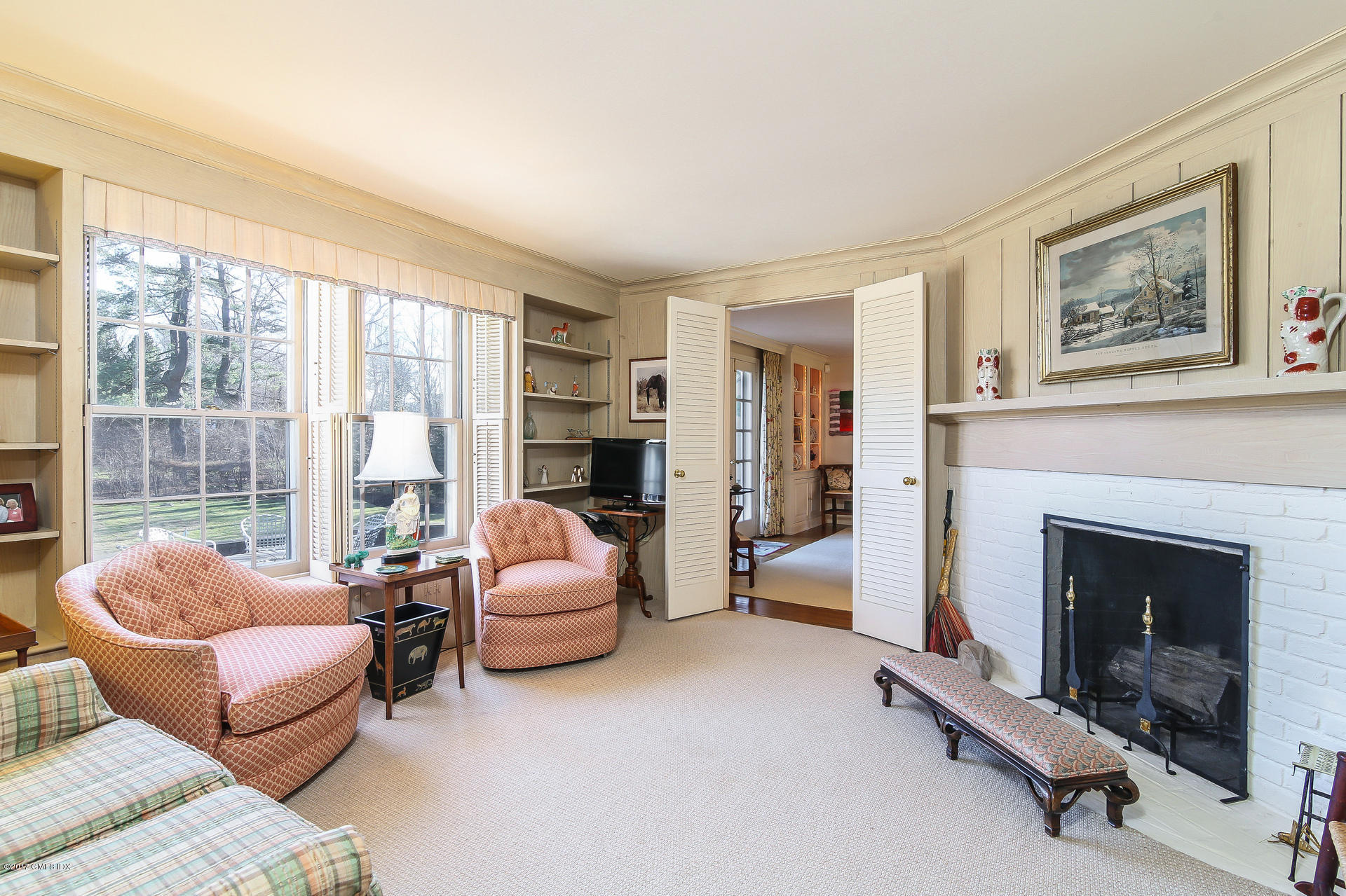 15 Beechcroft Road Greenwich, CT 06830 - Photo 10 of 21 a living room with furniture and a fireplace