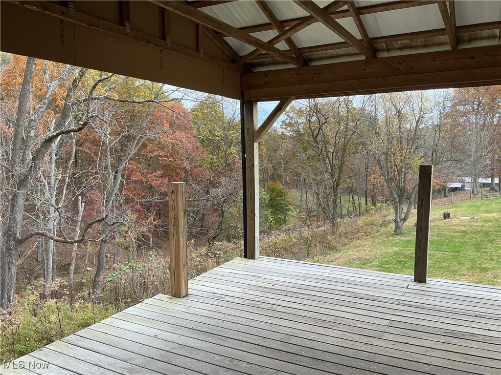 10550 Symmes Creek Road Adamsville, OH 43802 - Photo 6 of 21 Wooden deck featuring a yard