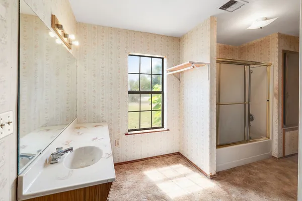 a bathroom with a sink and a bathtub