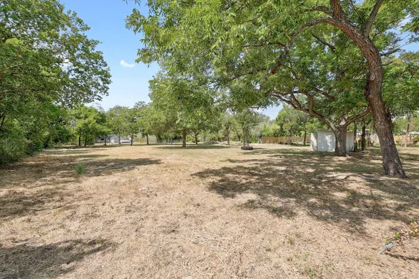 a view of outdoor space with deck and trees