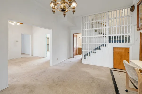 a view of a hallway with a chandelier