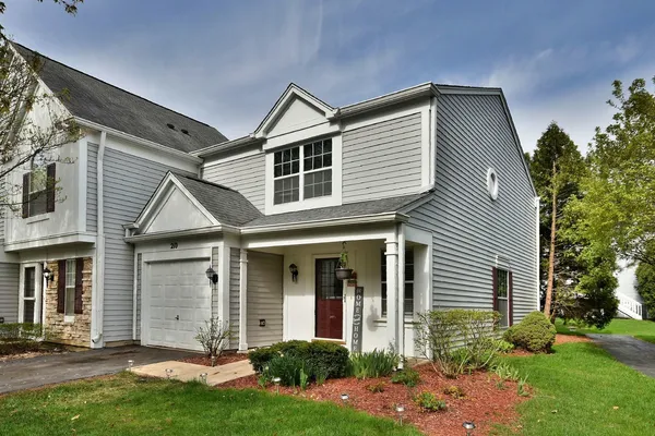 front view of a house with a yard