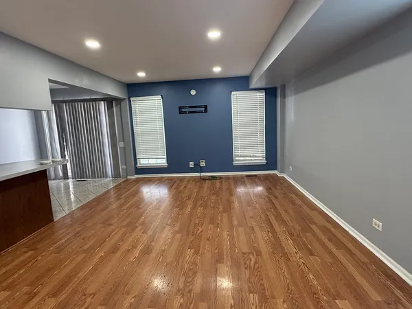 a view of livingroom with hardwood and furniture