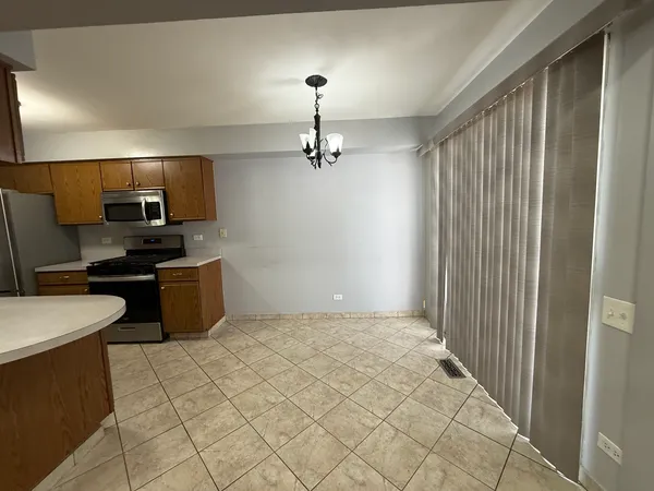 a kitchen with a sink cabinets and stainless steel appliances