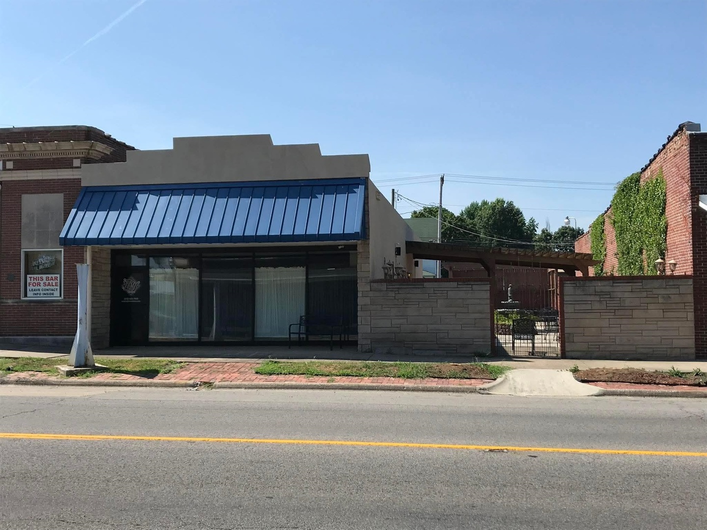 a view of a house with a wooden fence