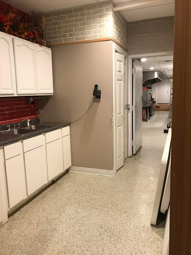 103 West Franklin Street Sesser, IL 62884 - Photo 15 of 17 a view of a hallway to a room and a cabinet