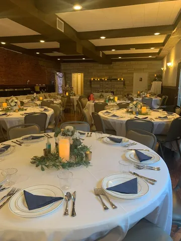 a room with lots of chairs and mirrors