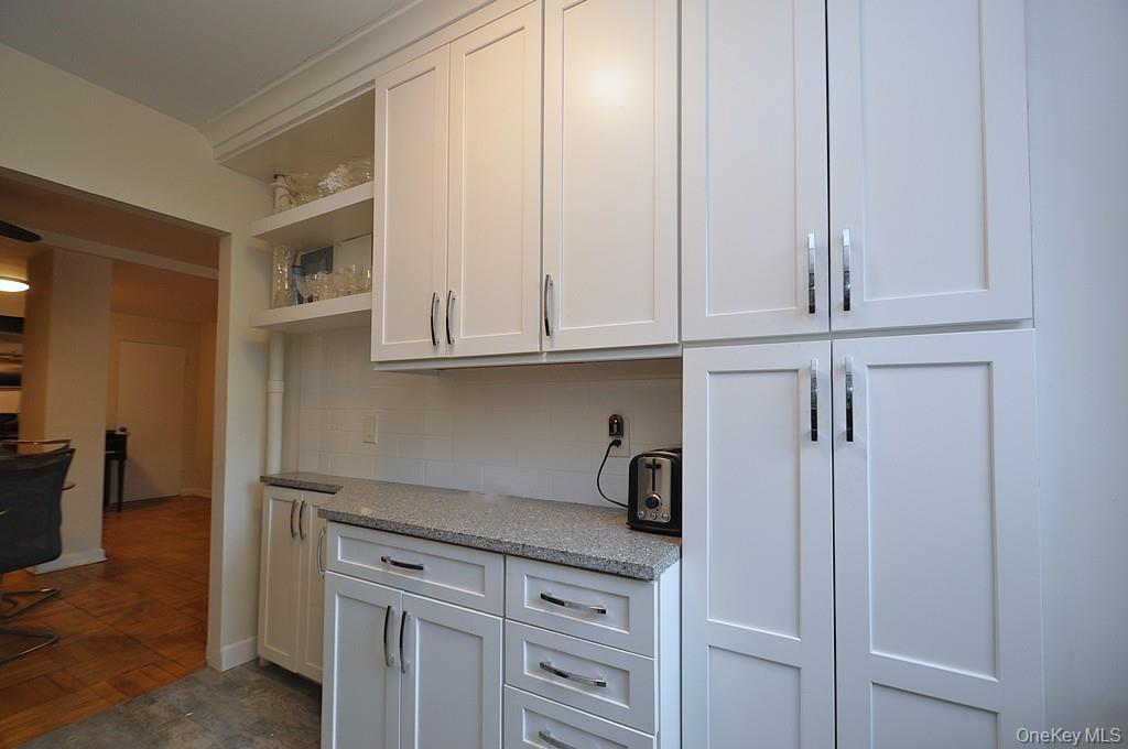 235 Garth Road, Unit A5B Scarsdale, NY 10583 - Photo 9 of 47 a view of cabinets and window
