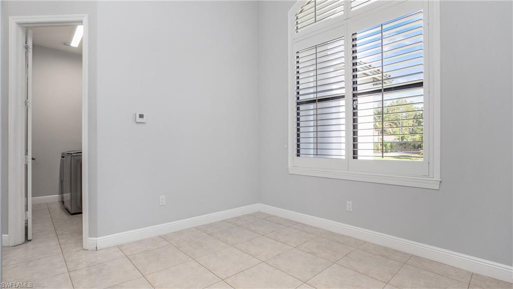 6341 Green Boulevard Naples, FL 34116 - Photo 20 of 48 an empty room with a window