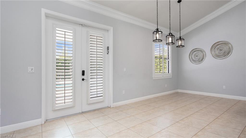 6341 Green Boulevard Naples, FL 34116 - Photo 25 of 48 a view of an empty room with a window