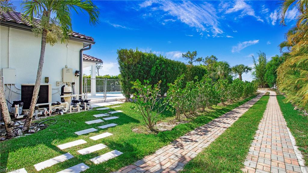 6341 Green Boulevard Naples, FL 34116 - Photo 36 of 48 a view of yard with patio