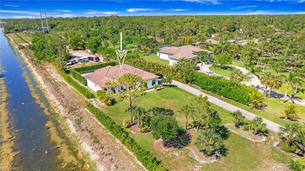 6341 Green Boulevard Naples, FL 34116 - Photo 39 of 48 a view of a lake with a mountain