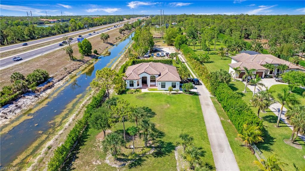 6341 Green Boulevard Naples, FL 34116 - Photo 40 of 48 View of subject property featuring a nearby body of water