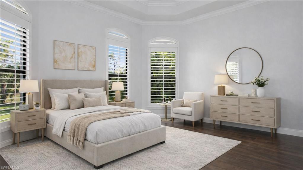 6341 Green Boulevard Naples, FL 34116 - Photo 8 of 48 a bedroom with a large bed and a chandelier