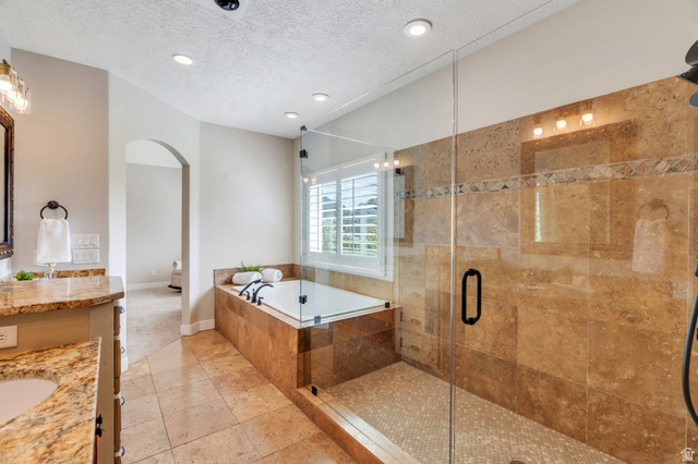1355 West 1000 South Mapleton, UT 84664 - Photo 21 of 74 Full bath with vanity, a bath, a textured ceiling, a stall shower, and recessed lighting