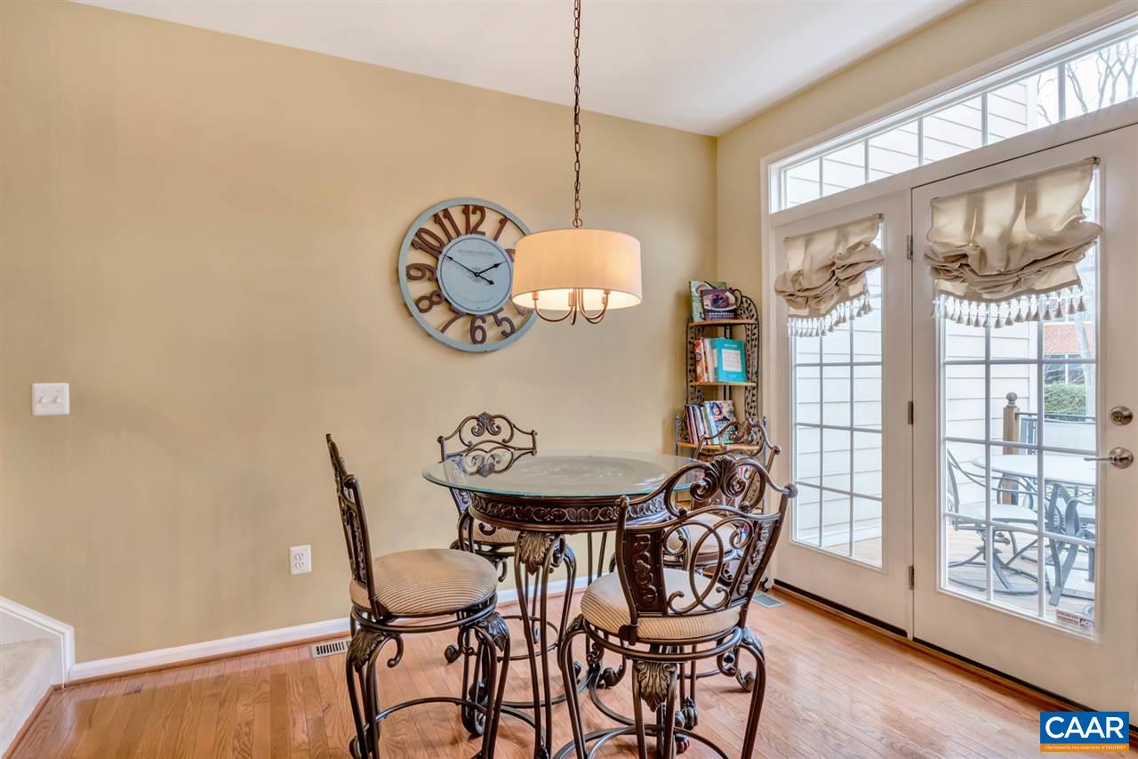 829 Rainier Road Charlottesville, VA 22903 - Photo 4 of 16 a view of a dining room with furniture large window and wooden floor