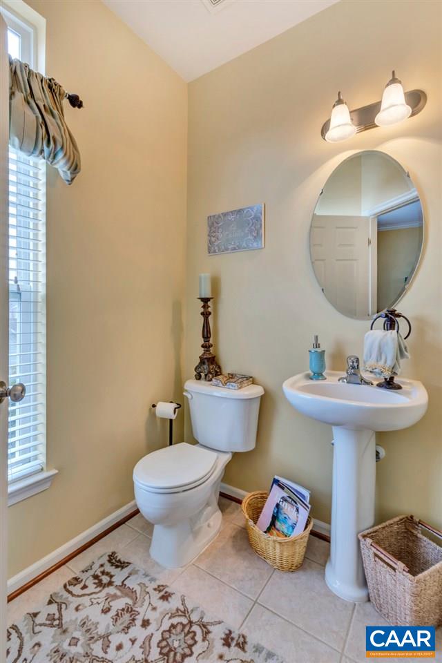829 Rainier Road Charlottesville, VA 22903 - Photo 8 of 16 a bathroom with a sink and a mirror