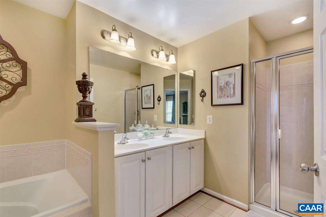 829 Rainier Road Charlottesville, VA 22903 - Photo 10 of 16 a bathroom with a double vanity sink mirror and shower