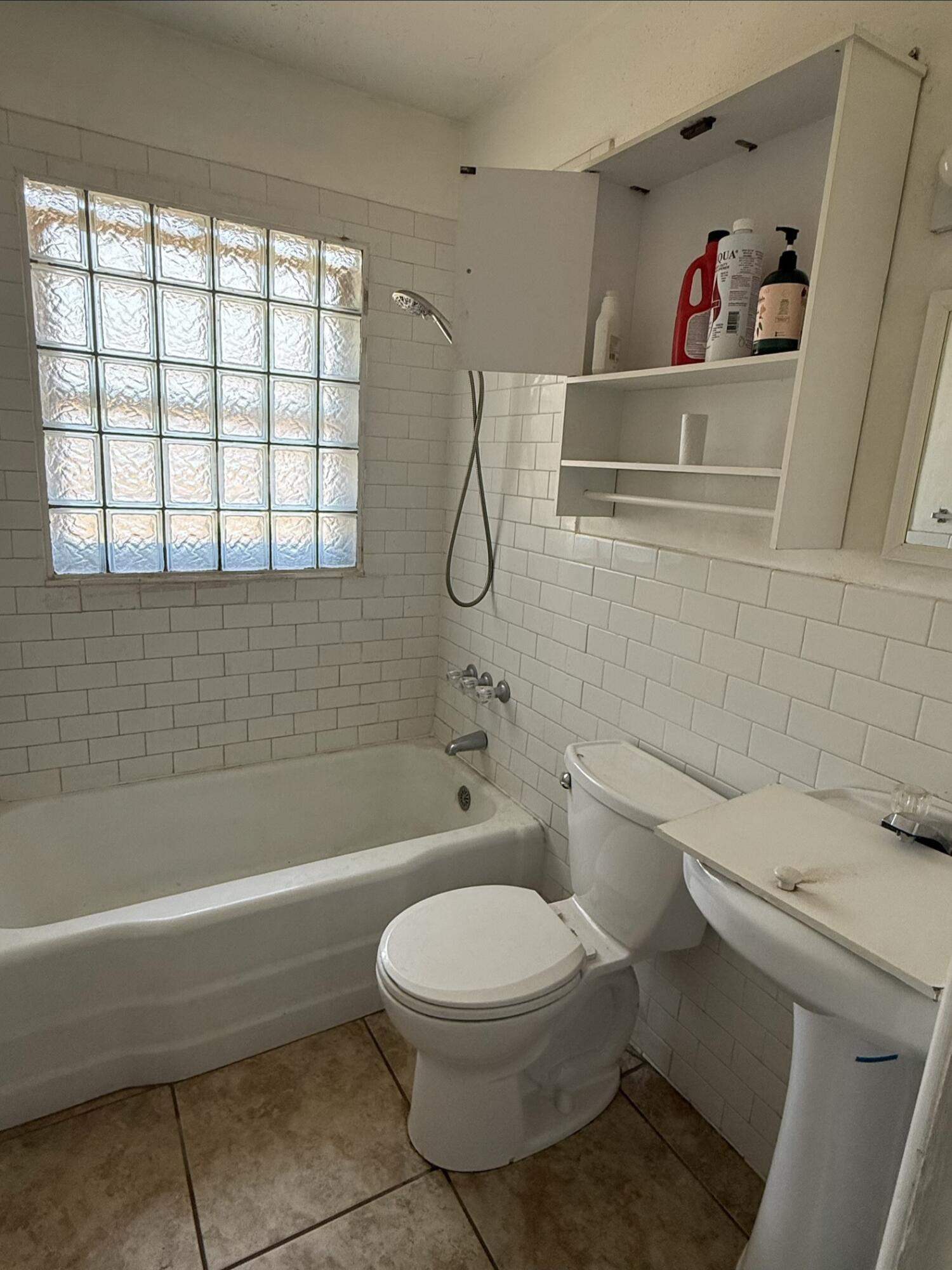 2817 63rd Street Lubbock, TX 79413 - Photo 7 of 16 a bathroom with a toilet and a shower