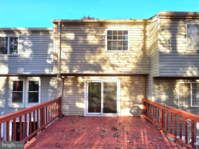 an empty room with entrance and windows