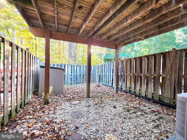 a white toilet sitting next to a bath tub