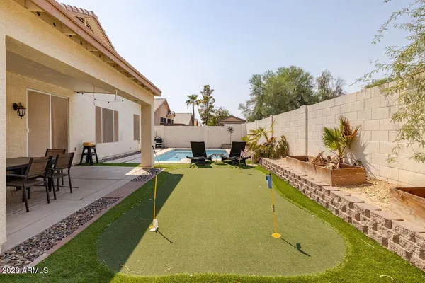 a view of a swimming pool with a patio