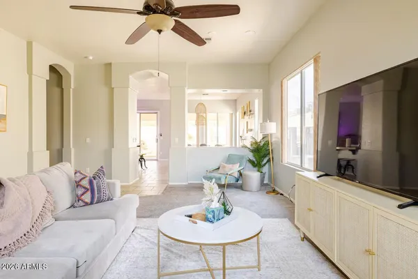 a living room with furniture and a flat screen tv