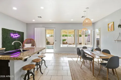 a living room with furniture and floor to ceiling window