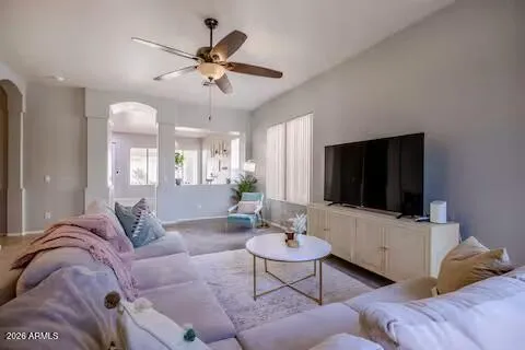 a living room with furniture and a flat screen tv