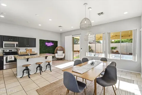 a view of a dining room with furniture window and outside view