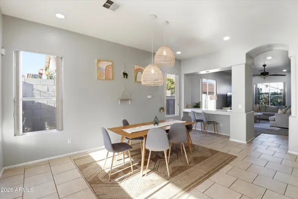 a bedroom with a bed and a potted plant