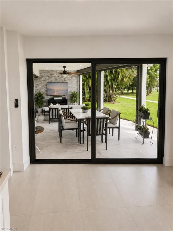 4556 Eagle Key Circle Naples, FL 34112 - Photo 12 of 29 Dining - Sliders to Lanai