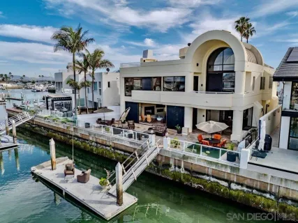 a very nice looking house with a big pool table and chairs