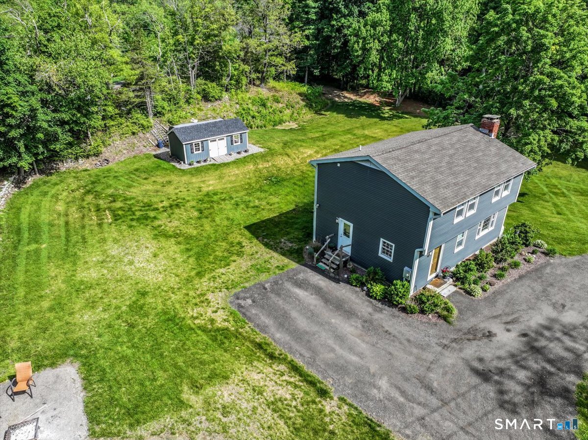 19 Botsford Hill Road Newtown, CT 06470 - Photo 37 of 40 a aerial view of a house with a yard and large trees